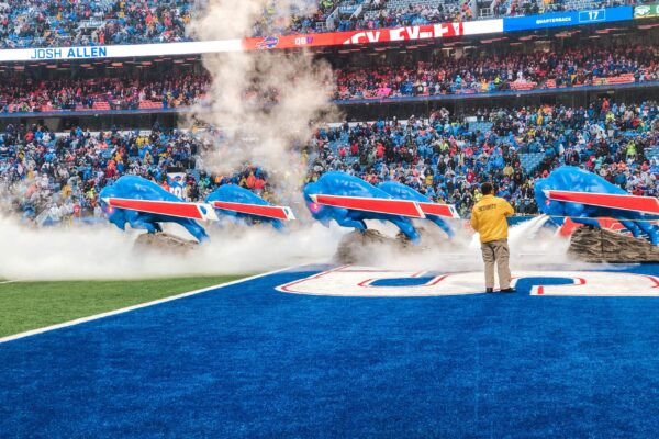 Photo of the Bills stampede blowing smoke out in the endzone with crowd cheering in the background