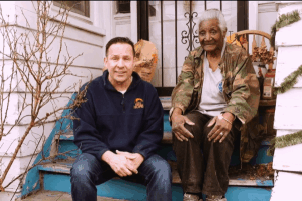 Eight days of hope volunteer with woman in the neighborhood