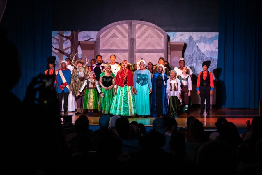Frozen Jr performance with cast singing on stage