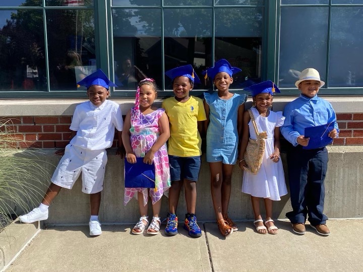 Westminster students posing for graduation photo outside the school